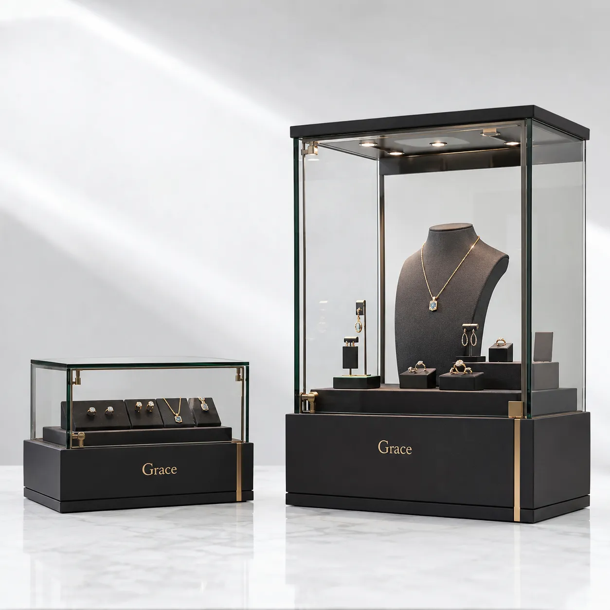 Luxury jewelry display cases set with matte black and gold finish for high end boutique jewelry store