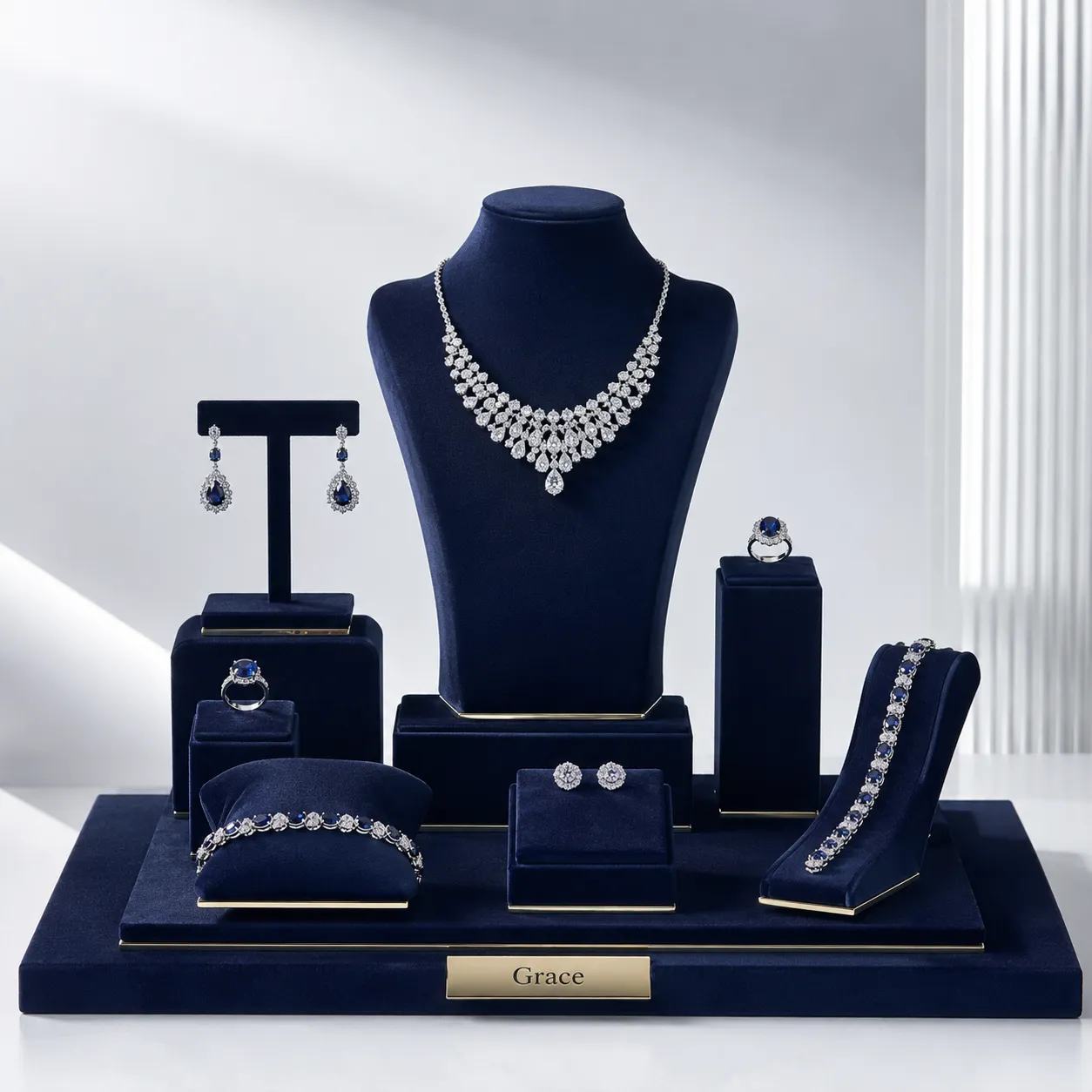 Bespoke navy blue velvet jewelry display prop sets with gold accents for shopfitting